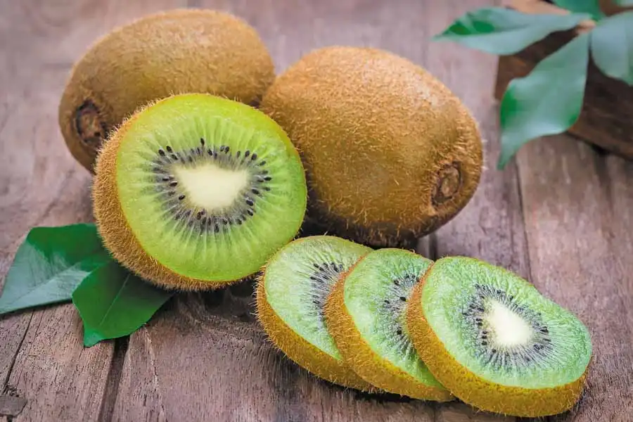 kiwi fruits on wooden table